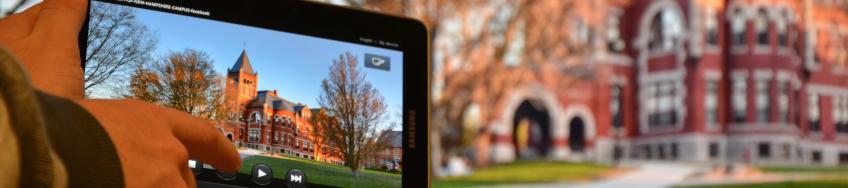 iPad in the foreground with UNH's Thompson Hall in the background